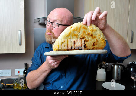 Mann, Pizza Stockfoto