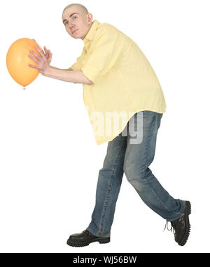 Der glatzköpfige Kerl in Jeans und ein Hemd mit einem gelben Ballon Stockfoto