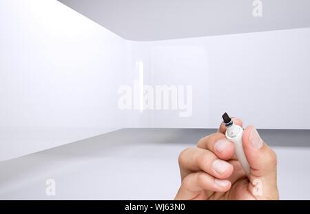 Das zusammengesetzte Bild von Hand mit einem Marker in Weiß 3d Raum Stockfoto