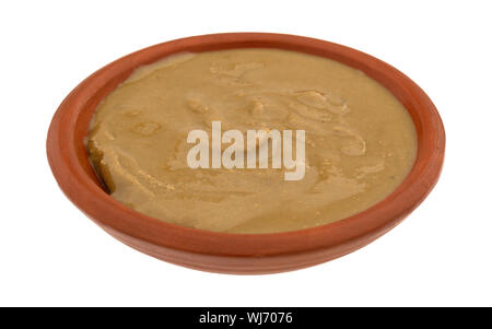 Seitenansicht des Bio Sonnenblumenöl Butter in einem kleinen Topf auf einem weißen Hintergrund. Stockfoto