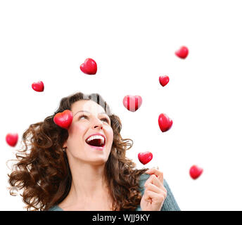 Schönheit junge Frau Valentine Herzen zu fangen. Liebe-Konzept Stockfoto