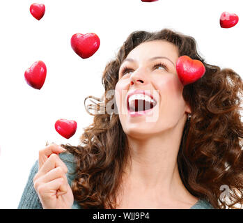 Schönheit junge Frau Valentine Herzen zu fangen. Liebe-Konzept Stockfoto