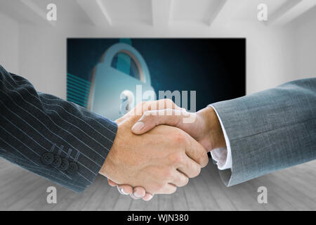 Das zusammengesetzte Bild im Business Handshake gegen Pfeil Tür im dunklen Zimmer Stockfoto