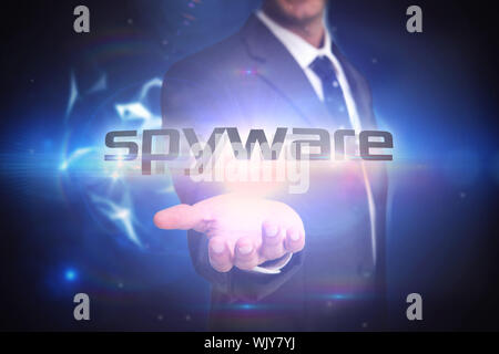 Der Begriff "Spyware" und Geschäftsmann Präsentation gegen glühende technologischer Hintergrund Stockfoto