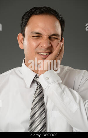 Geschäftsmann Zahnschmerzen leiden Stockfoto