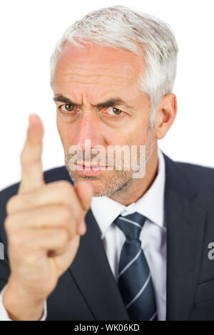 Wütend Geschäftsmann zeigte mit dem Finger und auf der Suche Stockfoto