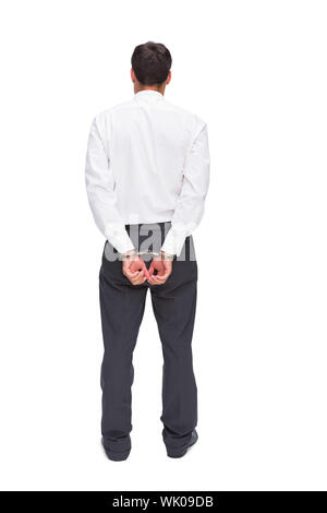 Rückansicht des jungen Geschäftsmann tragen Handschellen Stockfoto