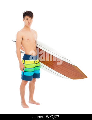 kleiner Junge mit einem Surfbrett über weißem Hintergrund Stockfoto