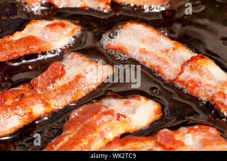 Ein Detail, Scheiben Speck in Fett Kochen Speck Stockfoto