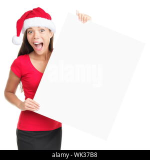 Reklametafeln Frau in Santa hat überrascht für Weihnachten. Asiatische schöne Happy Modell leer Zeichen auf weißem Hintergrund überrascht. Stockfoto