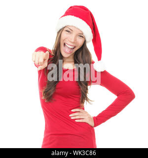 Frau in Santa hat aufgeregt für Weihnachten. Asiatische schöne glückliche Mädchen an der Kamera zeigt auf weißem Hintergrund überrascht. Stockfoto