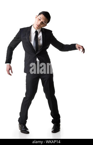 Marionette darstellen, Asian Business Mann isoliert auf Weiss. Stockfoto