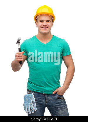 Reparatur, Bau und Instandhaltung Konzept - lächelnd männliche Arbeiter in Schutzhelm mit hammer Stockfoto