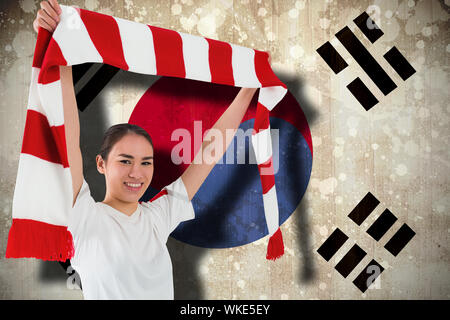 Fußball-Fan mit roten und weißen Schal gegen Südkorea Flagge Stockfoto