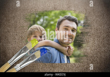 Das zusammengesetzte Bild von Vater und Sohn in den Park mit Pinsel eingetaucht in Blau gegen die verwitterte Oberfläche Stockfoto