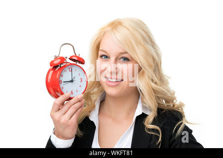 Blonde Frau mit roten Wecker lachen Stockfoto