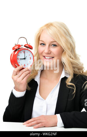 Blonde Frau mit roten Wecker lachen Stockfoto