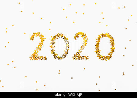 Neues 2020 Jahr Golden Star geformt Konfetti Hintergrund. Stockfoto