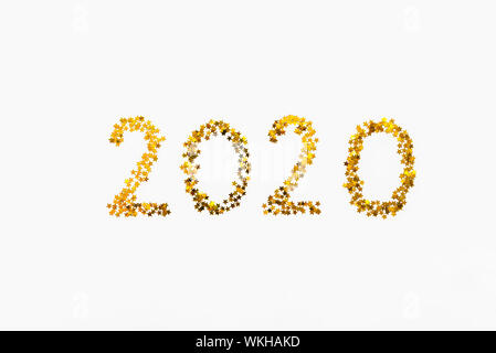 Neues 2020 Jahr Golden Star geformt Konfetti Hintergrund. Stockfoto