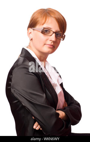 Schöne rothaarige business Frau mit schwarzen Anzug isoliert auf weißem Stockfoto