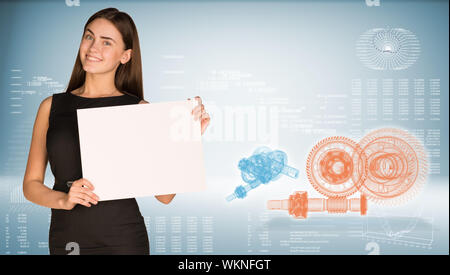 Geschäftsfrau holding Blatt Papier. High-tech-wire-frame Zahnräder und Grafiken als Hintergrund Stockfoto