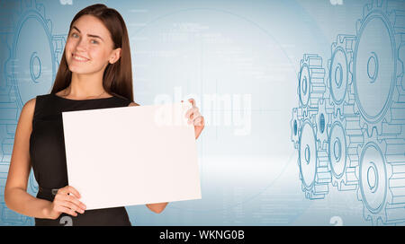 Geschäftsfrau holding Blatt Papier. High-tech-wire-frame Zahnräder und Grafiken als Hintergrund Stockfoto