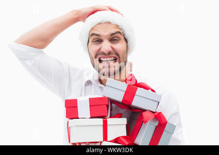 Betonte festliche Mann, Geschenke auf weißem Hintergrund Stockfoto