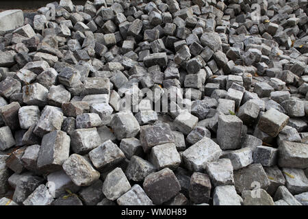 Baumaterial, Pflastersteine für Alte Straße Stockfoto