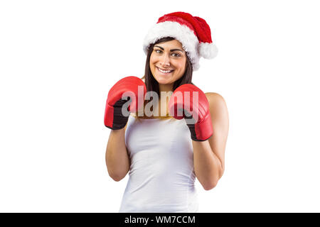 Festliche Brünette in Boxhandschuhen auf weißem Hintergrund Stockfoto