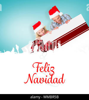 Das zusammengesetzte Bild von jungen festliche Paar gegen Baum Spirale Stockfoto