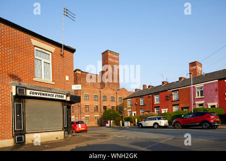 Tameside Wahrzeichen, aus rotem Backstein Tudno Mühle Smith St, Ashton-under-Lyne zu Hause Hill Kekse Ltd. Stockfoto