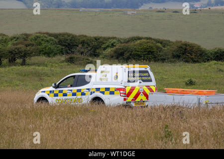 East Sussex, Beachy Head, Großbritannien, 10. Juli 2019: Die HM Coastguard Rettungsteam und Sussex Polizei an einen Vorfall auf der Klippe, einer der am meisten Stockfoto