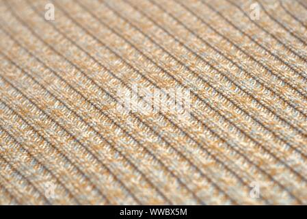 Meliert beige gestrickten Wollpullover. Textur Detail Nahaufnahme. Stockfoto