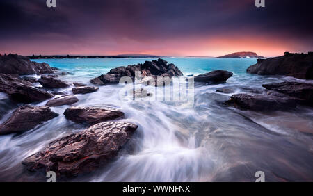 Sonnenaufgang über australischen Strand Stockfoto