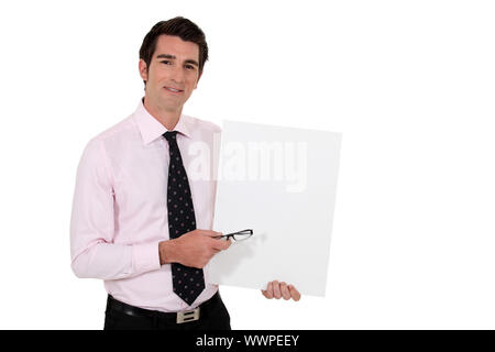 Geschäftsmann stand mit leeren poster Stockfoto