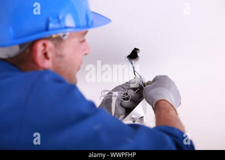 Handwerker-Montage-Strom Stockfoto