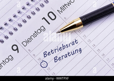 Termin für die Abstimmung mit Betriebsrat im Kalender Stockfoto