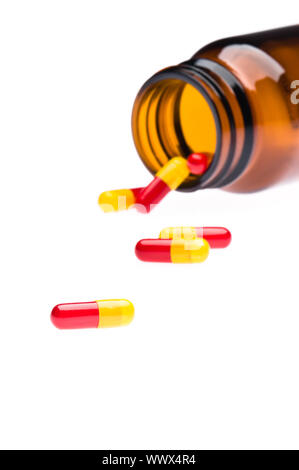 Eine Flasche weißen Pillen, übergegriffen. Stockfoto