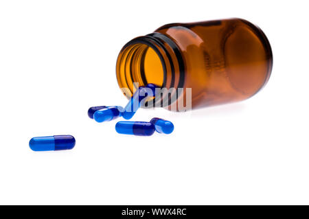 Eine Flasche weißen Pillen, übergegriffen. Stockfoto