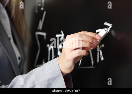 Lehrer zeichnen Zustand des Synchronismus phase Stockfoto