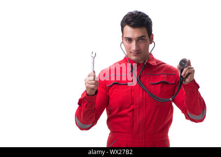 Die jungen gutaussehenden Mann mit einem Schraubenschlüssel festhalten und Stethoskop isoliert auf weißem Stockfoto