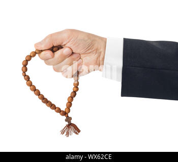 Hand mit gebetsperlen Stockfoto