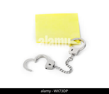 Leeres Papier mit Handschellen Stockfoto