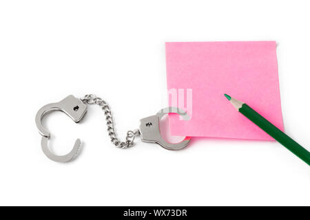 Leeres Papier mit Handschellen Stockfoto