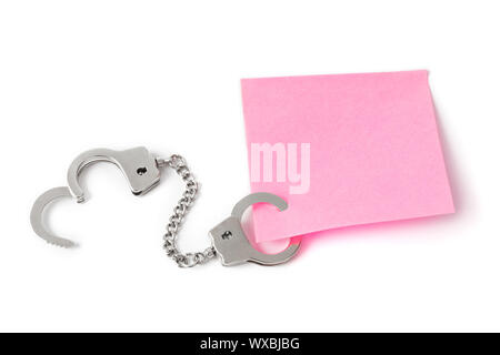 Leeres Papier mit Handschellen Stockfoto