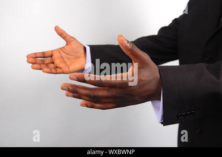 Das ist ein Bild für ein paar Hände zu Hilfe anbieten, 'business'-Stil. Stockfoto