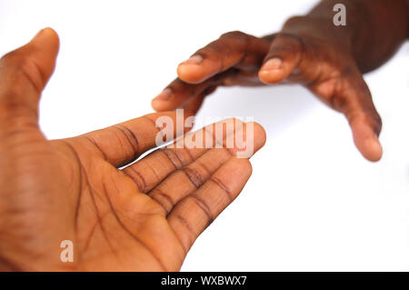 Das ist ein Bild für ein Paar schwarze Hände aus zu erreichen. Diese repräsentieren 'Liebe' verwendet werden können, "Hoffnung", usw... Stockfoto