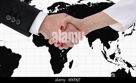 Der Mann und die Frau die Hände schütteln mit Karte der Welt im Hintergrund. Stockfoto