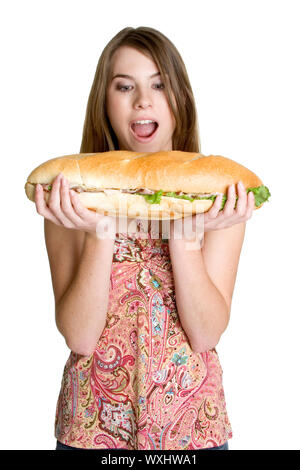 Isolierte Mädchen essen große Sandwich Stockfoto