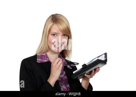 Ein Blick auf ihre Agenda Frau Stockfoto